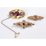 Three brooches, to include a Victorian yellow metal and stone set example, a 9 carat gold example