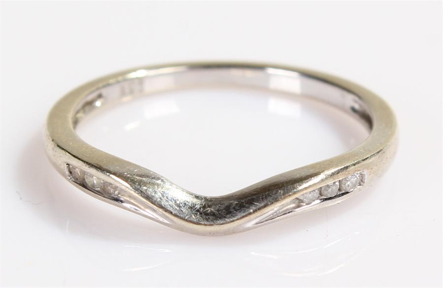 9 carat gold diamond set wedding band, with six diamonds to the shoulders, shaped band