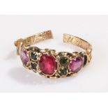 Yellow metal stone set ring, AF set with emeralds and pink stones
