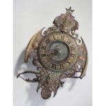 Postman's alarm clock with a base metal surrounding embossed with classical figure, 57cm high