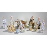 Eleven ceramic figures to include a milk maid with cow vase, figures in 18th century costume etc.