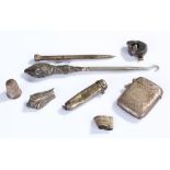 Silver objects, to include a vesta case, button hook, thimble, cigarette holder case, pencil and