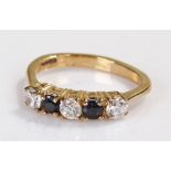 9 carat gold cubic zirconia and sapphire ring, set with a row of cubic zirconia and sapphires