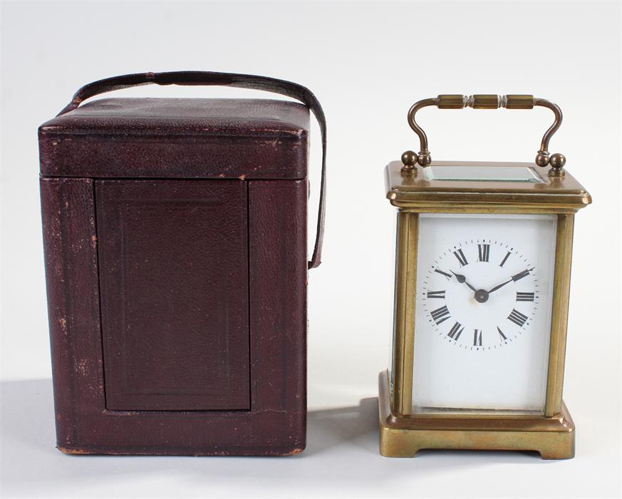 French carriage clock, the gilt brass case with bevelled glass, white enamel dial with Roman