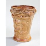 19th Century stoneware cup, with a dual character face to either side, 8.5cm high