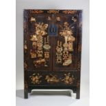 Chinese lacquer cabinet, probably mid to late 19th Century, the rectangular panel doors decorated in