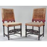 17th Century style pair of oak chairs, the pad back above a pad seat raised on a pair of barley