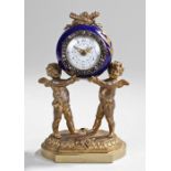 19th Century French porcelain and spelter clock, the porcelain case with gilt painted flowers raised