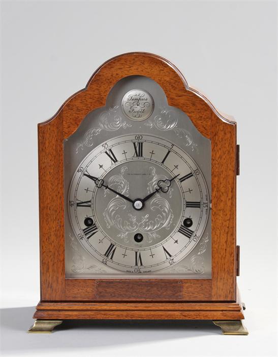 George III style mantel clock, The Alexander Clark Co. Ltd, the arched top above a conforming arched