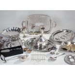 Silver plated wares, to include a meat dish, muffin dish, two trays, candlesticks, sauce boats,
