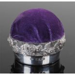 Elizabeth II silver pin cushion, London 1978, the pad top above a foliate collar and plain base,