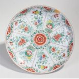 18th Century Chinese porcelain charger, the central red chrysanthemum with flowers held within red