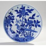 Chinese blue and white dish, Yongzheng mark, decorated with two birds on a rocky base with flowers