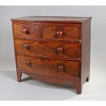 George III mahogany bow front chest of drawers of small proportions, the shaped top above a two over