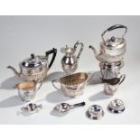 Silver plated teapot on stand, the gadrooned teapot above a base with burner and lion paw feet,