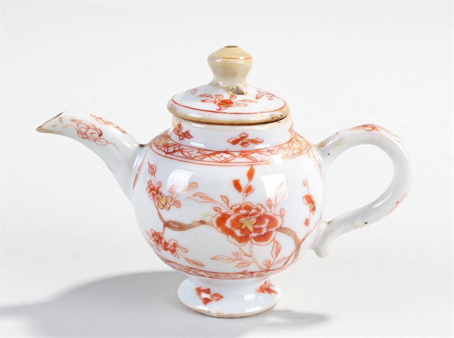 19th Century Chinese Teapot, the miniature teapot decorated in red with flowers and branches, 10.5cm