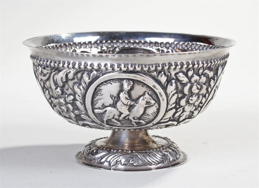 19th Century Northern Europeon silver bowl, embossed with hunting scenes among flowers and fruits,