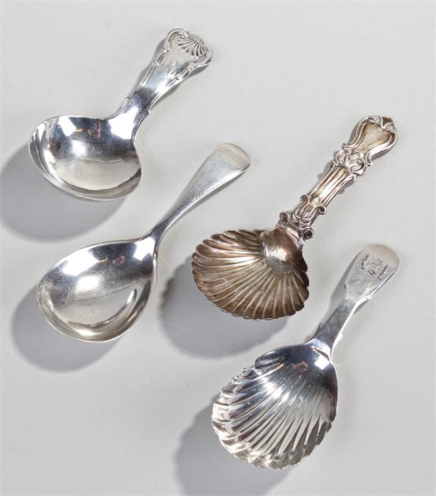 Four silver caddy spoons, to include a Victorian Irish silver shell bowl caddy spoon, Dublin 1848