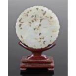 18th Century white jade plaque, Qianlong period, the disc carved with open work and God of