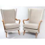 Pair of Bambino armchairs, designed by Howard Keith, stuff over upholstery, label to the underside