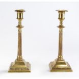 Pair of mid 18th Century style English brass candlesticks, the sconces with arched gadrooned edges