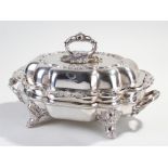 Silver plated entrée dish, the acanthus leaf handle above a shaped cover with heraldic crest, with a