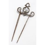 19th Century steel skewer holder, with registration mark and two metal skewers, the holder 8cm wide,