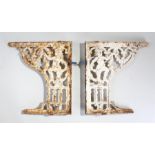 Pair of Victorian brackets, painted in white with scrolls and figures, 42cm high