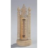 Early 19th Century mounted thermometer, the fret carved top with turned columns central mercury