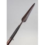 Congo spear, the steel blade with wire work attached to the carved shaft with lion carved end, 121cm