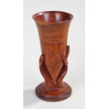 Early 20th Century Pitcairn Island vase, the carved vase with a hand gripping a vase and the text