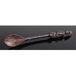 Early 20th Century Southern African spoon, carved with a figure above a stem and bowl, 26cm high