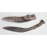 Oman white metal jambiya, with foliate decorated sheath with horn grip, red stone set decoration,