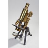 Swift & Son microscope, the microscope signed Swift & Son, London with gilt brass and black body
