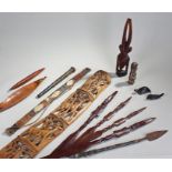 Ethnographical objects, to include African spears, figures, a carved panel and further weapons, (