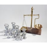 Scale set and bell weights, the scales with brass pans and arm, together with a selection of bell