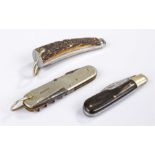 Three penknives, to include a stag antler example, a horn example and a steel example, (3)
