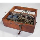 Electro magnetic shock machine, circa 1900, within a mahogany case, 26cm wide