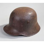 World War II German helmet, slight traces of original paint remain