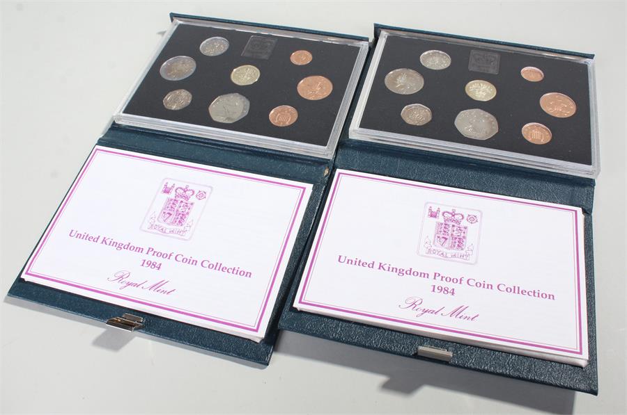 Two 1984 Royal Mint Presentation sets, cased (2)