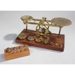 Sampson Mordan & Co brass postal scales, with fitted weights, together with another set of weights