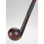 19th Century Swazi knobkerrie, the ball end with flat "snuff" service above a wire work handle, 55cm