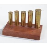 Kynoch's shotgun cartridge display, with No 8 gauge, 10, 12, 16 and 20 on a mahogany display stand