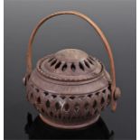 Southern African carved pot, the fret carved lidded pot with swing handle, 12cm wide