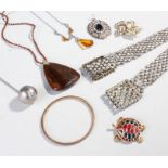 Mixed lot of costume jewellery comprising of three necklaces, one belt, one pendant, one bangle