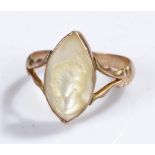 Yellow metal carved mother of pearl cameo ring, carved as a bust, ring size P