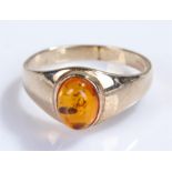 9 carat gold amber ring, the amber carved into a cabouchon