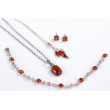 Silver and amber jewellery, to include a bracelet, pair of earring and two necklaces with