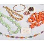 Mixed lot of costume jewellery comprising of one bangle, one pair of earrings, two brooches and four