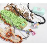 Mixed lot made up of costume jewellery comprising of seven necklaces, one brooch and one pair of